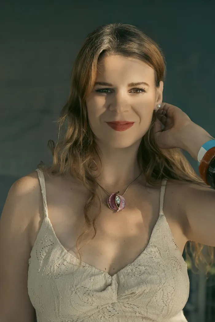 Portrait of Rezi smiling in golden light