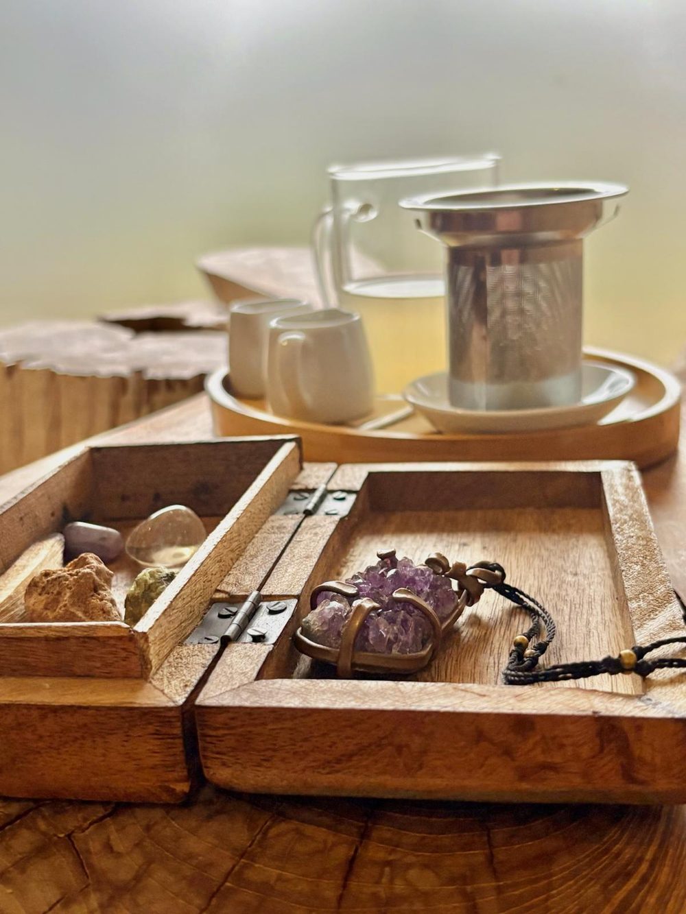 Crystals, amethyst talisman and herbal tea ritual
