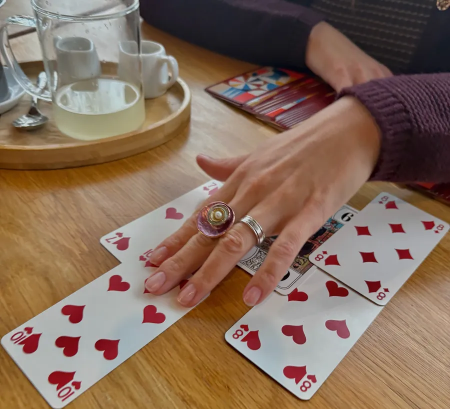 Close-up of Rezi's tarot and playing cards